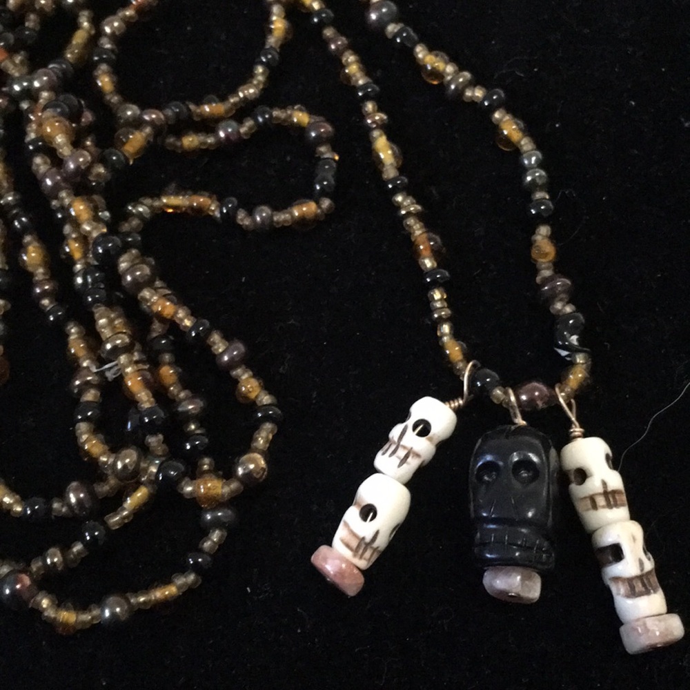 Long glass beaded necklace/ skulls